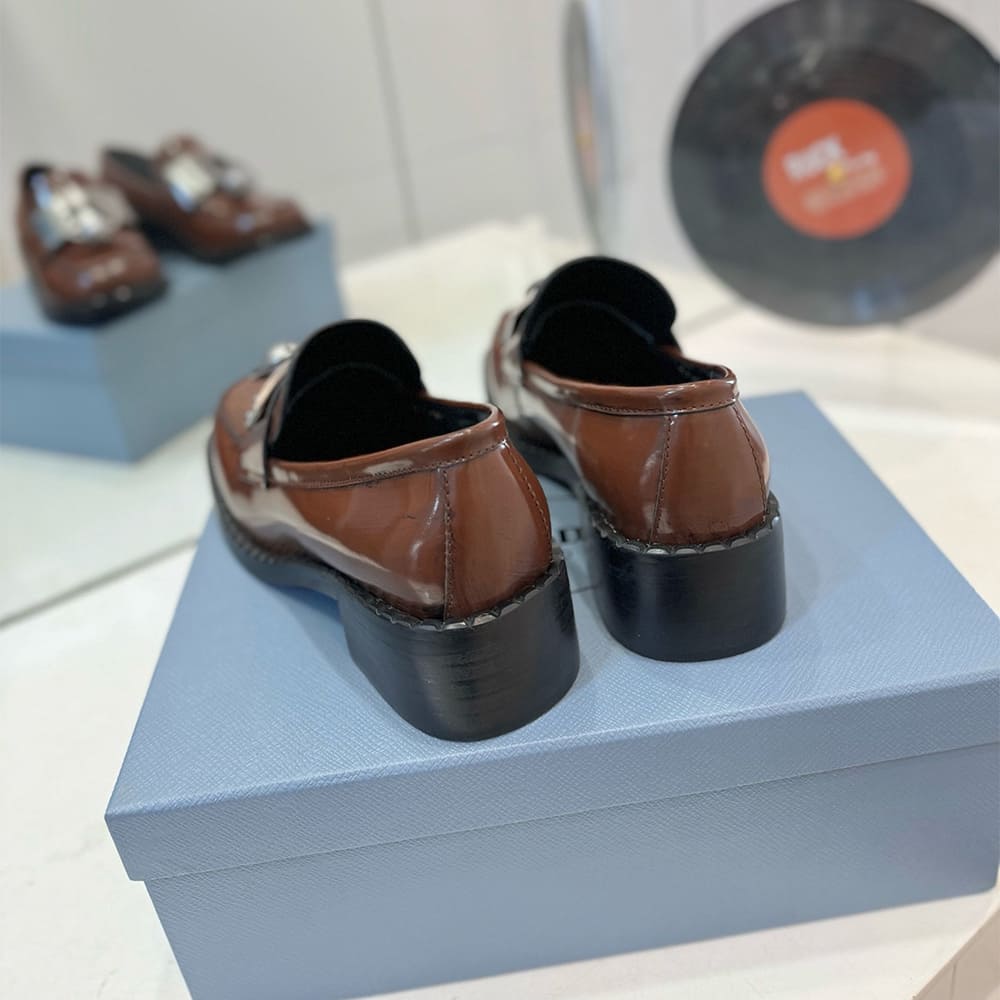 PRADA Brushed leather loafers with metal details